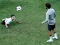 Mohamed Salah plays football with a child during training ahead of the UEFA Super Cup on August 14, 2019