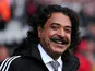 Fulham's Pakistani-born US owner Shahid Khan smiles before the English Premier League football match between Fulham and Arsenal at Craven Cottage in London on August 24, 2013