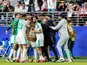 Nadhir Benbouali of Algeria celebrates a goal with teammates
