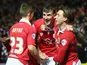 Bristol City players Aden Flint, Luke Freeman and Joe Bryan celebrate the opening goal against Peterborough on February 17, 2015