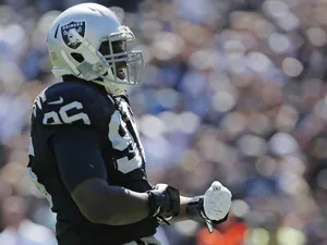 Linebacker Christo Bilukidi of the Oakland Raiders celebrates a sack on Chad Henne of the Jacksonville Jaguars in the second quarter on September 15, 2013