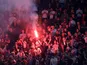Liverpool fans light a flare inside the stadium before the Champions League semi-final second leg against Roma on May 2, 2018
