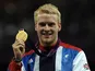 Paralympic athlete Jonnie Peacock celebrates his goal medal in the men's 100m at London 2012 on September 6, 2012