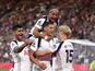Micky van de Ven of Tottenham Hotspur celebrates with Xavi Simons, Cristian Romero and Lucas Bergvall