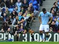 Steven Caulker celebrates scoring for Spurs as Aguero stands dejected