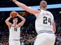 Nikola Jokic passes to Denver Nuggets teammate Mason Plumlee on December 16, 2018