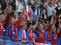 Crystal Palace players celebrate with the Football League Championship play off final trophy on May 27, 2013