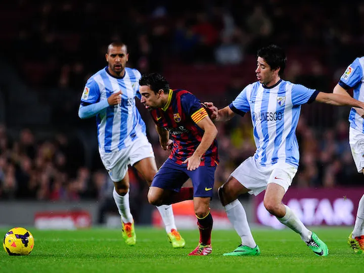 Barcelona lead Malaga at break