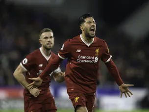 Liverpool coast to win over Huddersfield