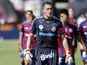 San Lorenzo's goalkeeper Pablo Migliore walks on to the pitch with teammates on March 16, 2013