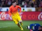 Barcelona's Lionel Messi celebrates his goal against Granada on February 16, 2013