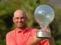Thomas Bjorn with the trophy after winning the Nedbank Golf Challenge on December 8, 2013