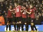Man Utd players congratulate Robin Van Persie after opening the scoring against Tottenham on January 20, 2013