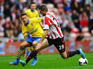 Ozil starts well as Arsenal lead