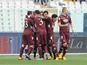 Torino's Alessio Cerci is congratulated by team mates after scoring his team's second against Pescara on January 20, 2013