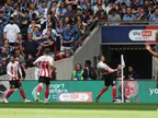 Sunderland beat Wycombe to secure Championship return