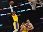  Los Angeles Lakers forward LeBron James (23) moves in for a dunk as center JaVale McGee (7) provides coverage against Milwaukee Bucks center Brook Lopez (11) during the first half at Staples Center on March 7, 2020