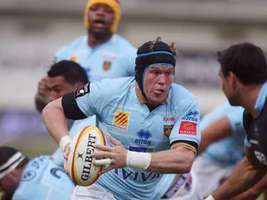 Perpignan's number-eight Luke Narraway runs with the ball during the French Top 14 rugby union match Perpignan-Bayonne in Perpignan on September 8, 2012