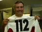 Jason Leonard of England displays a commemorative number 112 jersey after setting a new world record of 112 international apppearances during the Rugby World Cup semi-final against France on November 16, 2013