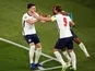 England's Harry Kane celebrates scoring their third goal with Declan Rice and Raheem Sterling on July 3, 2021