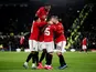 Manchester United's Odion Ighalo celebrates scoring their third goal with Manchester United's Fred and teammates on March 5, 2020