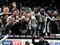 Newcastle United players celebrate being crowned champions of the Championship on May 7, 2017