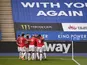 Manchester United players celebrate Bruno Fernandes's goal against Leicester City in the Premier League on July 26, 2020