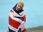 Georgina Hermitage poses with the British flag after winning gold in the women's T37 100m at the Rio Paralympics on September 9, 2016