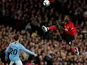 Manchester United midfielder Paul Pogba gets to the ball ahead of Manchester City's Bernardo Silva on April 24, 2019