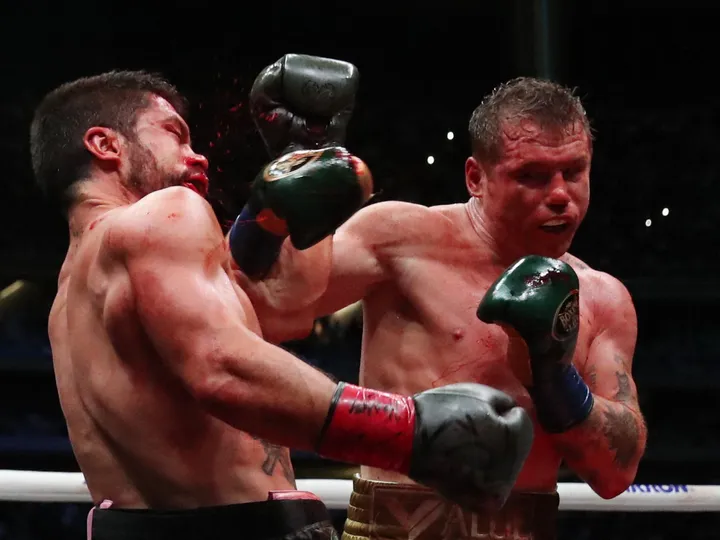 Canelo Alvarez defeats gutsy John Ryder to defend world titles