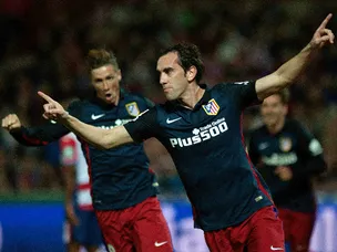 Godin header gives Atletico lead at Granada
