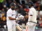 India's Rohit Sharma celebrates his half century with Cheteshwar Pujara on August 27, 2021