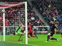 Olivier Giroud scores the opening goal against Bayern Munich on March 13, 2013