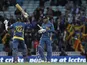 Sri Lanka's Kumar Sangakkara teammate Nuwan Kulasekera celebrate after they defeated England in their ICC Champions Trophy match on June 13, 2013 