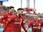 Toronto FC forward Jesus Jimenez (9) celebrates with midfielders Luca Petrasso (38, left) and Jacob Shaffelburg (22) after scoring against New York City FC in the first half at BMO Field on April 2, 2022