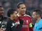 Liverpool captain Virgil van Dijk and Paris Saint-Germain captain Marquinhos speak to the referee on April 14, 2026