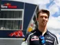 Daniil Kvyat of Toro Rosso walks in the paddock during previews to the Spanish Formula One Grand Prix at Circuit de Catalunya on May 12, 2016 