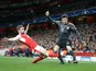 Shkodran Mustafi slides in Robert Lewandowski during the Champions League game between Arsenal and Bayern Munich on March 7, 2017