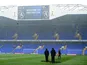 Groundstaff at White Hart Lane clear the snow from the pitch ahead of the match against Manchester United on January 20, 2013