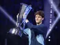 Jannik Sinner poses with the trophy after winning the ATP Finals on November 17, 2024
