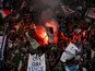 Lazio's fans let off a flare before the game against Real Madrid on October 3, 2007