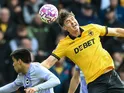 Jorgen Strand Larsen of Wolverhampton Wanderers jumps up to win a high ball on October 5, 2025