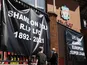 Anti Super League banners and Liverpool fans are seen outside Anfield as twelve of Europe's top football clubs launch a breakaway Super League