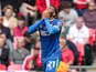 AFC Wimbledon's Myles Hippolyte celebrates after scoring on May 26, 2025