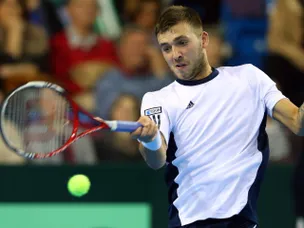 Dan Evans sets up Roger Federer clash
