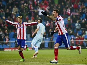 Atletico hold slender lead over Granada