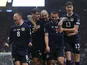 Scotland's Callum McGregor celebrates scoring their first goal with teammates on June 20, 2023