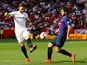 Barcelona's Luis Suarez in action with Sevilla's Sergi Gomez during their La Liga clash on February 23, 2019