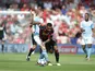 Joshua King attempts to manhandle Kevin De Bruyne during the Premier League game between Bournemouth and Manchester City on August 26, 2017