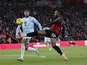 Antoine Semenyo of Bournemouth competes with Josh Laurent of Burnley in the box on December 20, 2025
